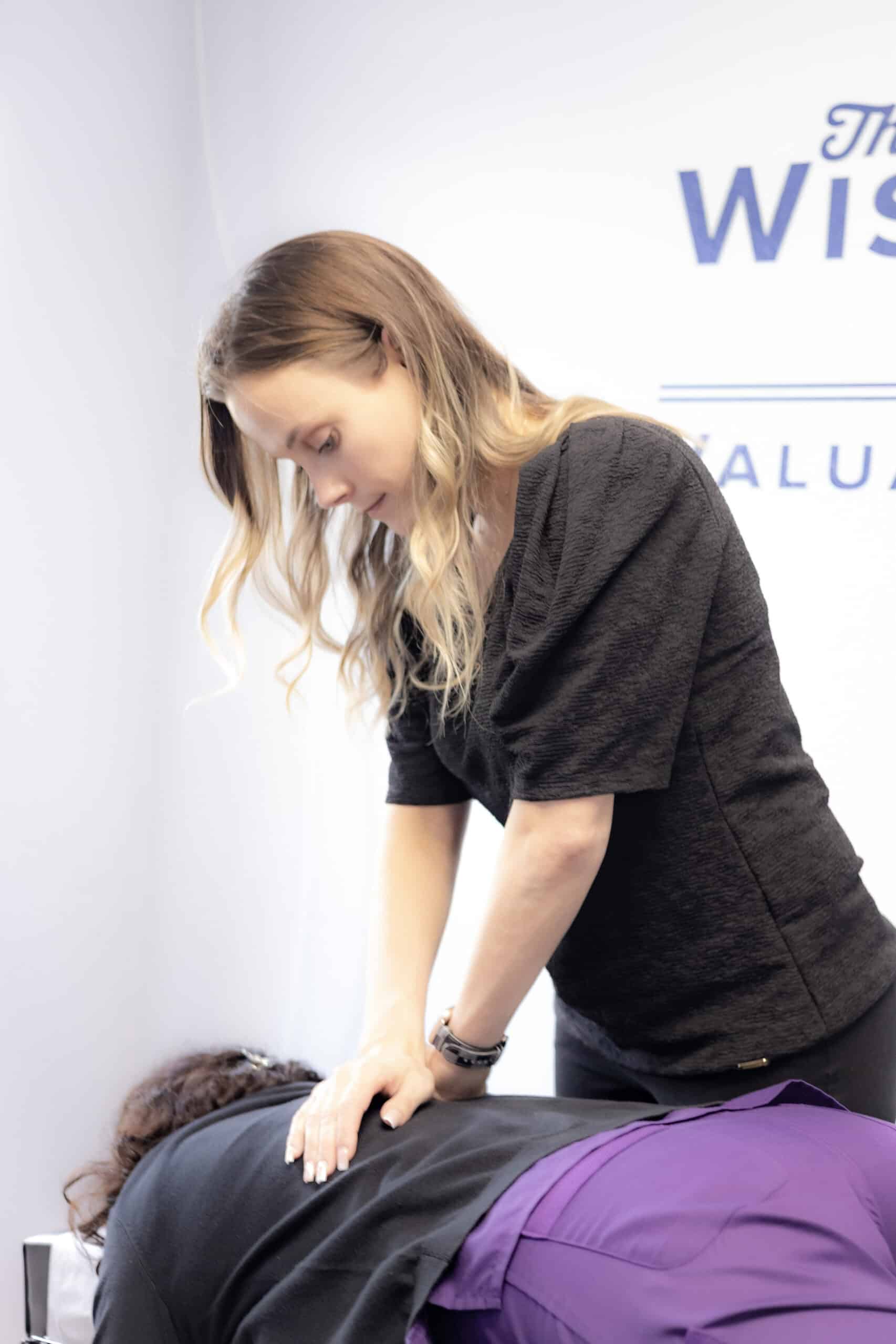 Dr. Amy Kerr adjusting patient at Grace Medical & Chiropractic